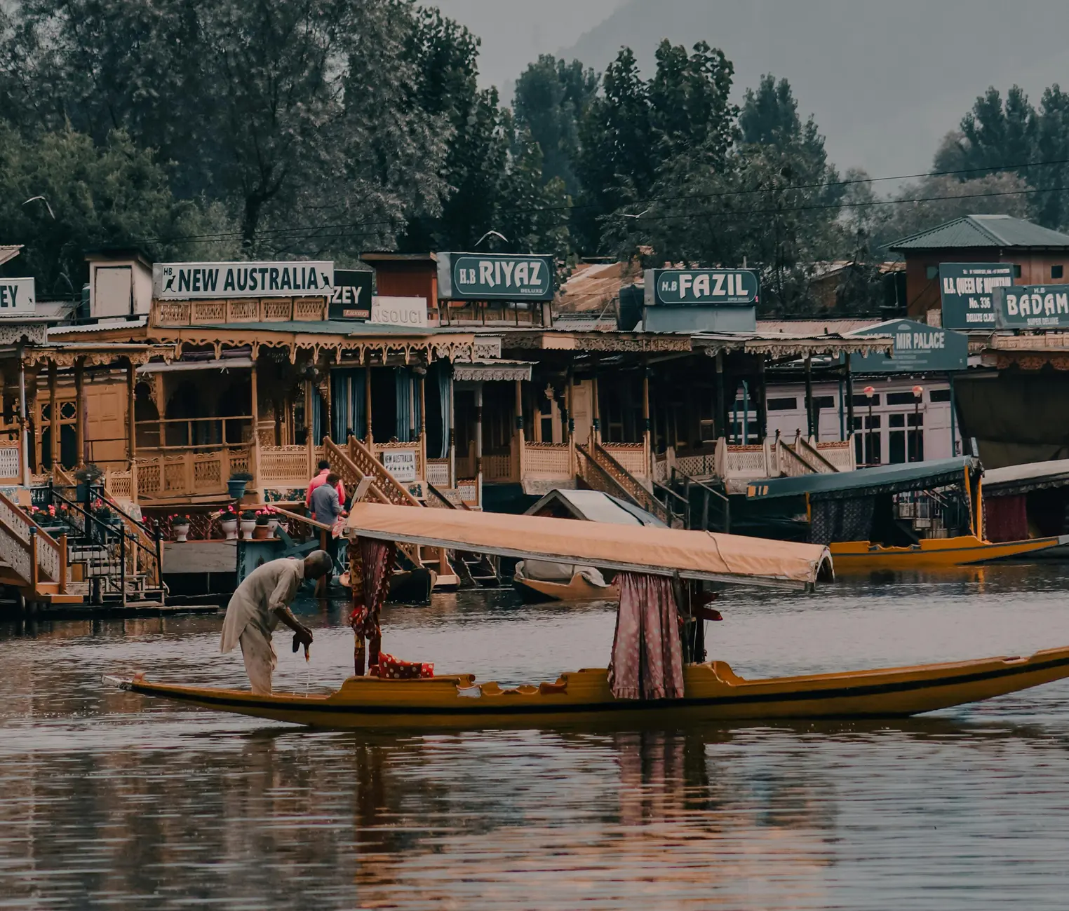 A peaceful Shikara ride on the serene Dal Lake, a famous activity in Kashmir.